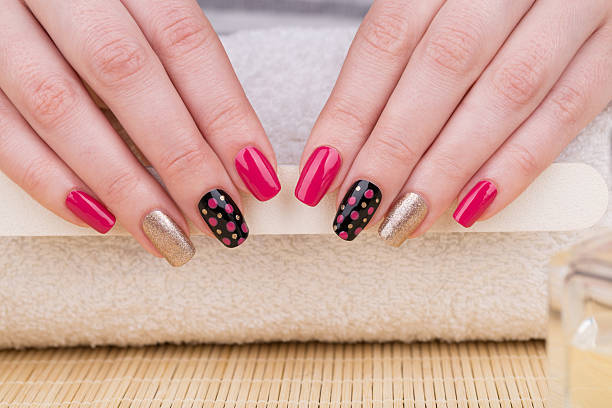 Black pink polka dot nail design