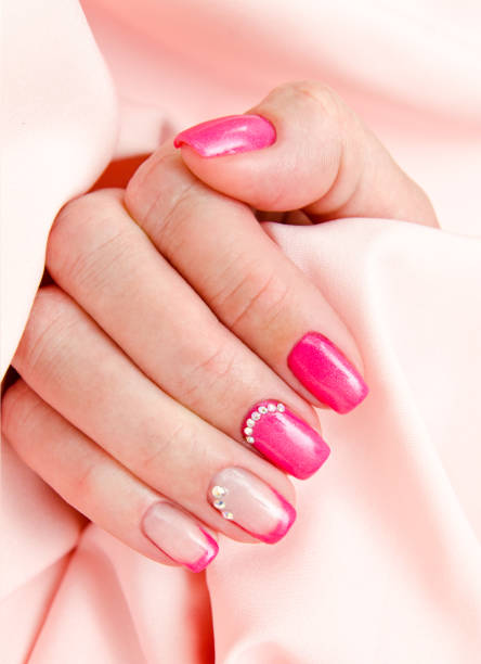 pink nail art with rhinestones