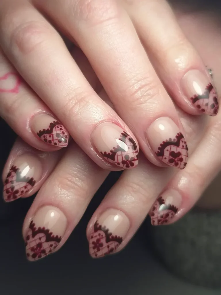 Nude burgundy lace nails.